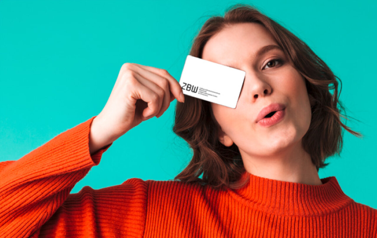 Woman showing her ZBW card
